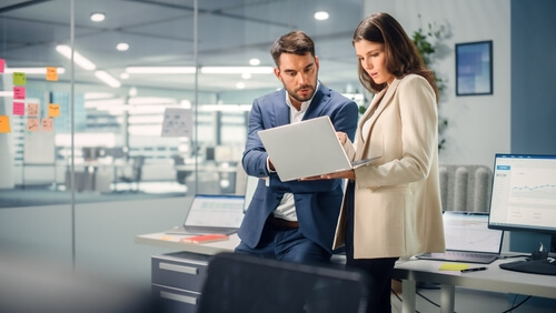 Company leader guiding new employee 