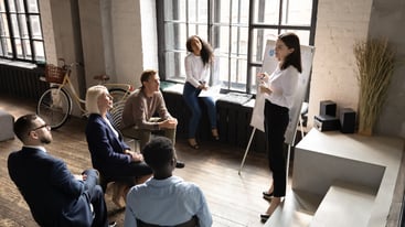 Female company trainer conducting a new hire onboarding session